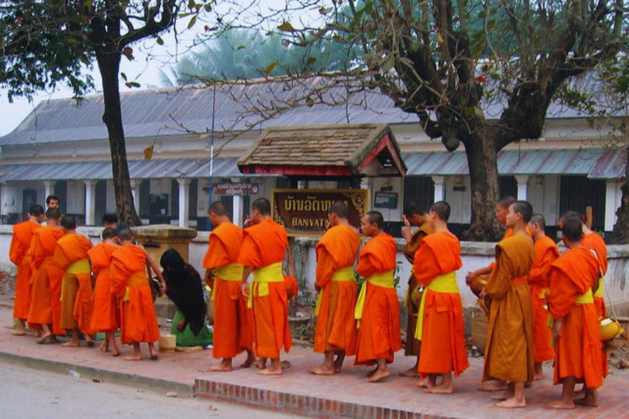 Alms giving ceremony with monks in Luang Prabang Laos cultural tradition – Auasia Travel